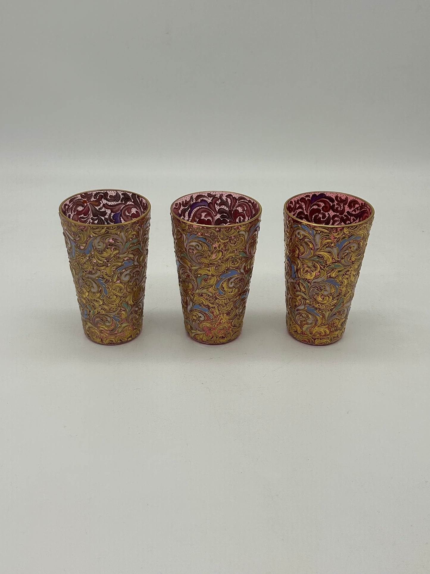 Set of Ornate Gilt Tumblers with Red Interior