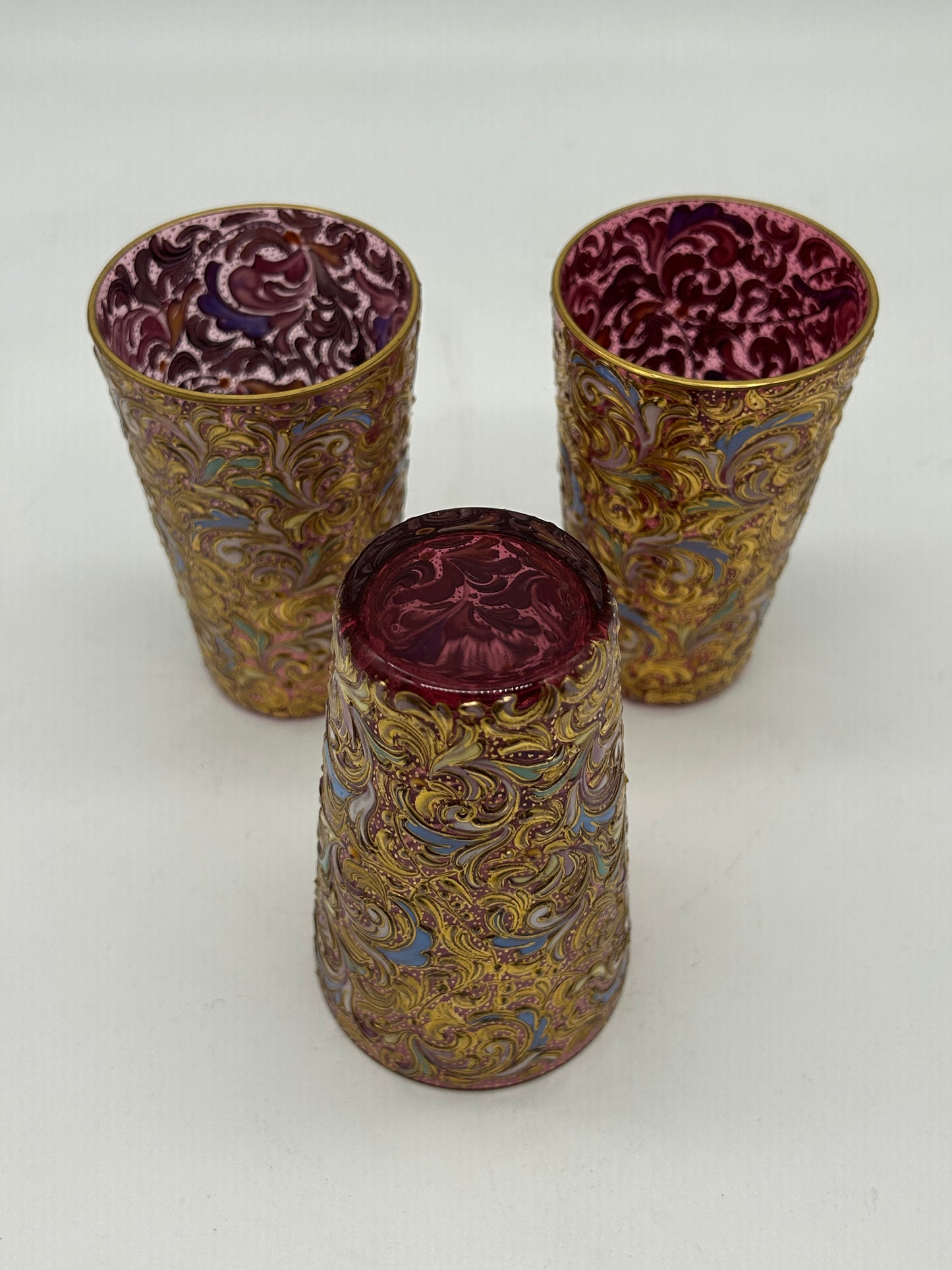 Set of Ornate Gilt Tumblers with Red Interior